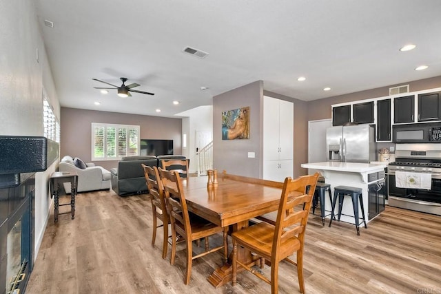 339 Diamante Way, Oceanside, CA 92056 - dining room with ceiling fan, recessed lighting, light wood-type flooring, and stairs