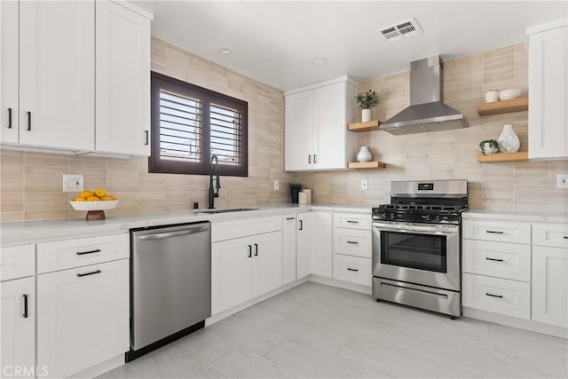 933 N Lincoln St, Burbank, CA 91506 - kitchen with appliances with stainless steel finishes, open shelves, wall chimney range hood, light countertops, and backsplash
