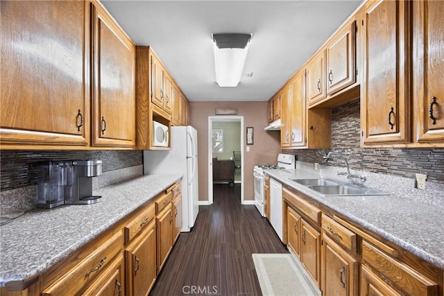 2818 Renegade Ave, Bakersfield, CA 93306 - kitchen with white appliances, tasteful backsplash, dark wood-style flooring, and under cabinet range hood