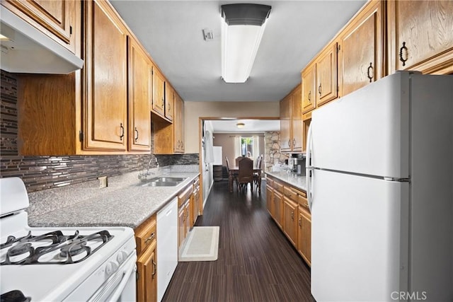 2818 Renegade Ave, Bakersfield, CA 93306 - kitchen with white appliances, decorative backsplash, and dark wood-style flooring