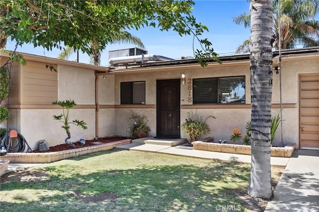 2818 Renegade Ave, Bakersfield, CA 93306 - view of front of home with stucco siding and a front lawn