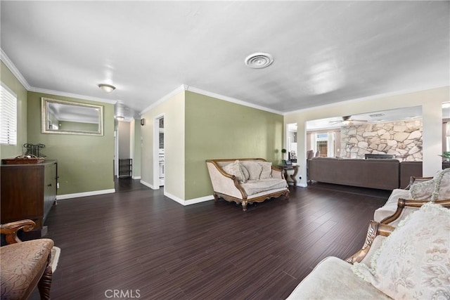 2818 Renegade Ave, Bakersfield, CA 93306 - living room featuring ornamental molding, ceiling fan, a stone fireplace, and wood finished floors