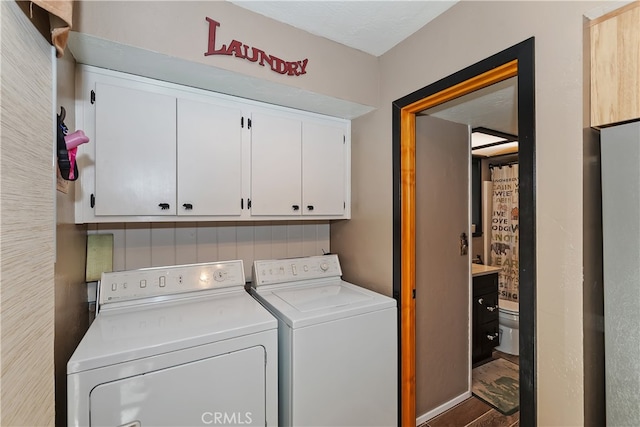 721 Riverside Ave, Sugarloaf, CA 92386 - laundry room featuring cabinet space and washing machine and clothes dryer