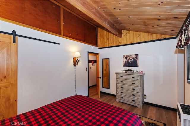 721 Riverside Ave, Sugarloaf, CA 92386 - bedroom with lofted ceiling, wooden ceiling, wood finished floors, and a barn door