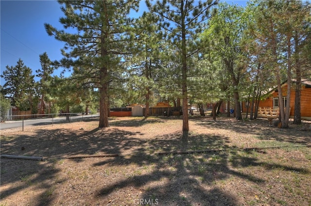 721 Riverside Ave, Sugarloaf, CA 92386 - fenced backyard featuring a storage unit
