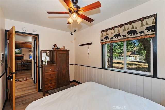 721 Riverside Ave, Sugarloaf, CA 92386 - bedroom with wood finished floors and ceiling fan