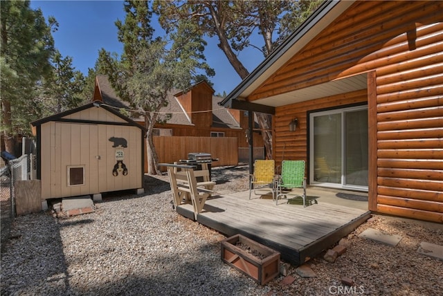 721 Riverside Ave, Sugarloaf, CA 92386 - view of yard featuring a storage shed and a wooden deck