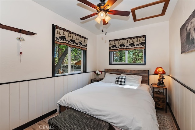 721 Riverside Ave, Sugarloaf, CA 92386 - bedroom with wood finished floors and ceiling fan