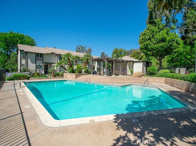 4674 Maxwell Ct, Riverside, CA 92501 - community pool with a pergola and a patio area