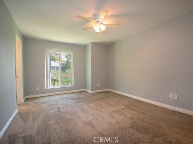 4674 Maxwell Ct, Riverside, CA 92501 - spare room featuring carpet floors and a ceiling fan