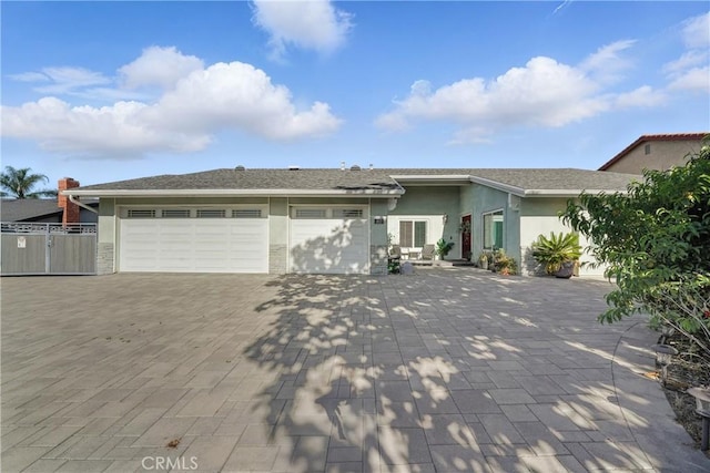 1817 Balboa Way, Upland, CA 91784 - view of front of house featuring stucco siding, an attached garage, and decorative driveway