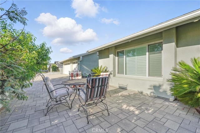 1817 Balboa Way, Upland, CA 91784 - view of patio / terrace with concrete driveway and an attached garage