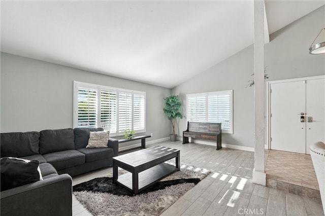1817 Balboa Way, Upland, CA 91784 - living area featuring wood tiled floors and high vaulted ceiling