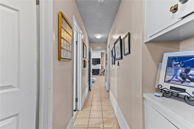 19121 Galatina St, Rowland Heights, CA 91748 - corridor with light tile patterned flooring and a textured ceiling