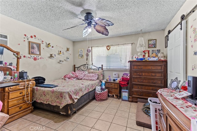 19121 Galatina St, Rowland Heights, CA 91748 - bedroom with light tile patterned floors, a barn door, a textured ceiling, and ceiling fan