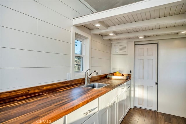 21018 Yankee Valley Rd, Hidden Valley Lake, CA 95467 - kitchen with wooden counters, beam ceiling, dark wood-style flooring, and white cabinetry