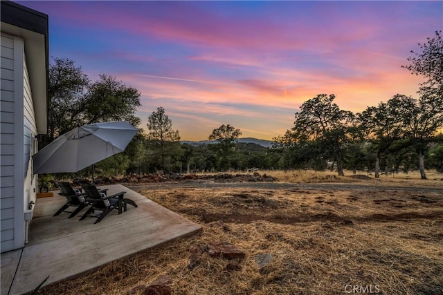 21018 Yankee Valley Rd, Hidden Valley Lake, CA 95467 - yard at dusk featuring a patio and a mountain view