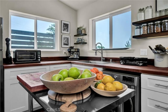 21018 Yankee Valley Rd, Hidden Valley Lake, CA 95467 - kitchen featuring wooden counters, open shelves, and white cabinets