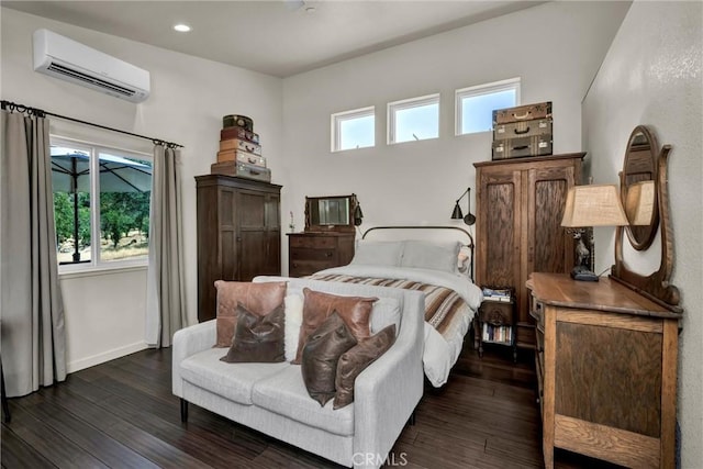 21018 Yankee Valley Rd, Hidden Valley Lake, CA 95467 - bedroom with an AC wall unit, dark wood-style floors, and recessed lighting