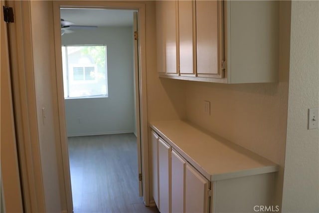 80 Greenmoor Unit 40, Irvine, CA 92614 - corridor featuring wood finished floors and baseboards