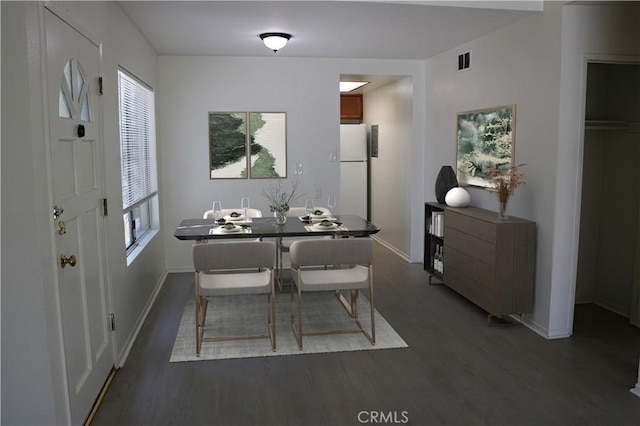 80 Greenmoor Unit 40, Irvine, CA 92614 - dining room with dark wood-style flooring and baseboards