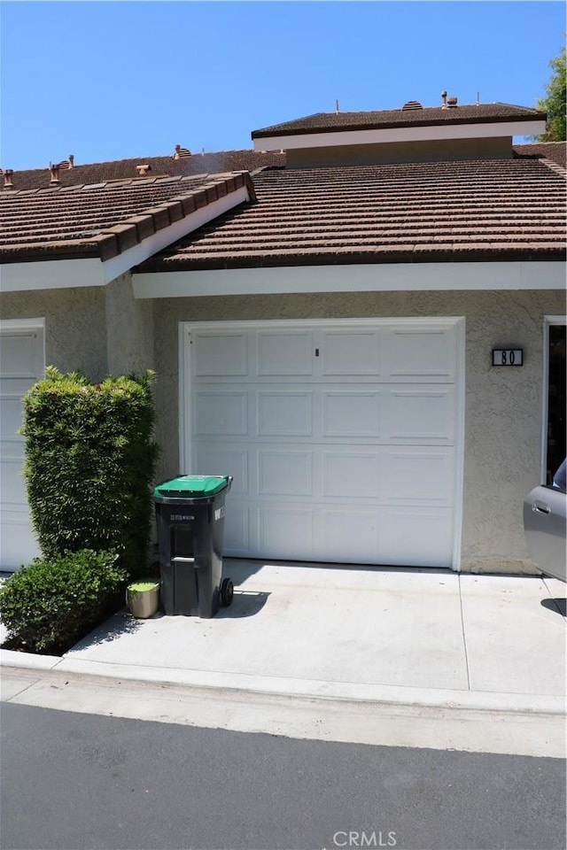 80 Greenmoor Unit 40, Irvine, CA 92614 - garage with driveway