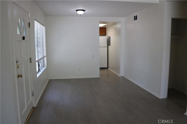 80 Greenmoor Unit 40, Irvine, CA 92614 - unfurnished dining area featuring wood finished floors and baseboards