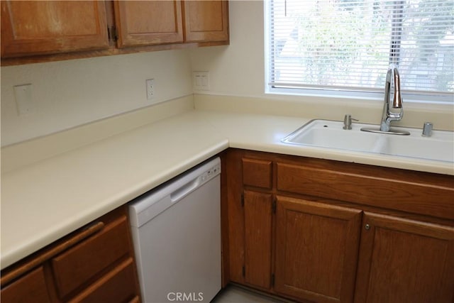 80 Greenmoor Unit 40, Irvine, CA 92614 - kitchen with dishwasher, brown cabinetry, and light countertops
