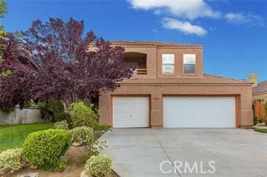 38742 Berrycreek Ct, Palmdale, CA 93551 - view of front facade featuring a garage, concrete driveway, and stucco siding