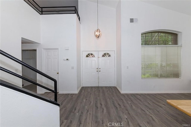 38742 Berrycreek Ct, Palmdale, CA 93551 - foyer entrance with a high ceiling, wood finished floors, and stairway