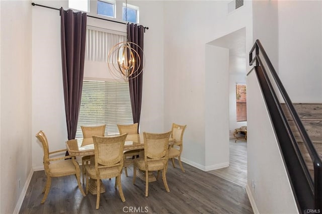 38742 Berrycreek Ct, Palmdale, CA 93551 - dining room featuring a chandelier, wood finished floors, and a high ceiling