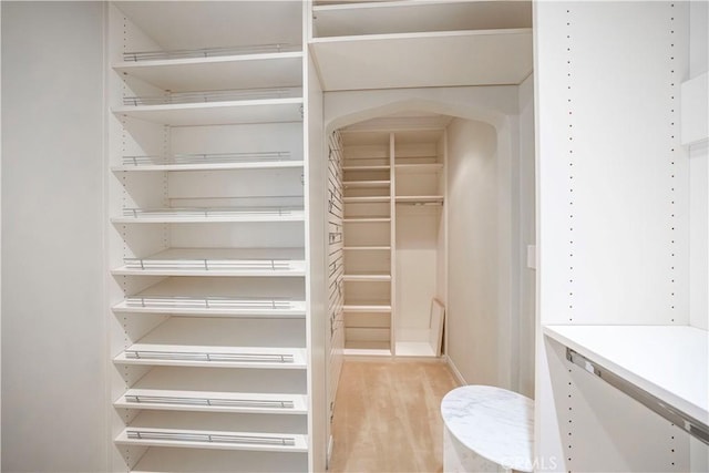1911 Pepper Dr, Altadena, CA 91001 - spacious closet with wood finished floors and arched walkways