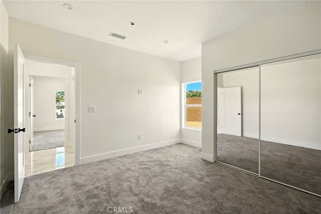 36733 42nd St E, Palmdale, CA 93552 - unfurnished bedroom featuring carpet floors, multiple windows, and a closet