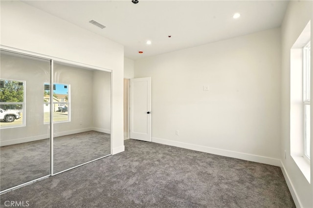 36733 42nd St E, Palmdale, CA 93552 - unfurnished bedroom featuring dark colored carpet, a closet, and recessed lighting
