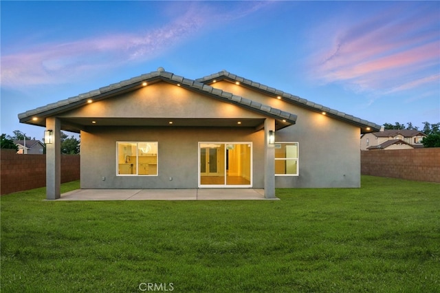 36733 42nd St E, Palmdale, CA 93552 - back of property with a fenced backyard, stucco siding, and a patio