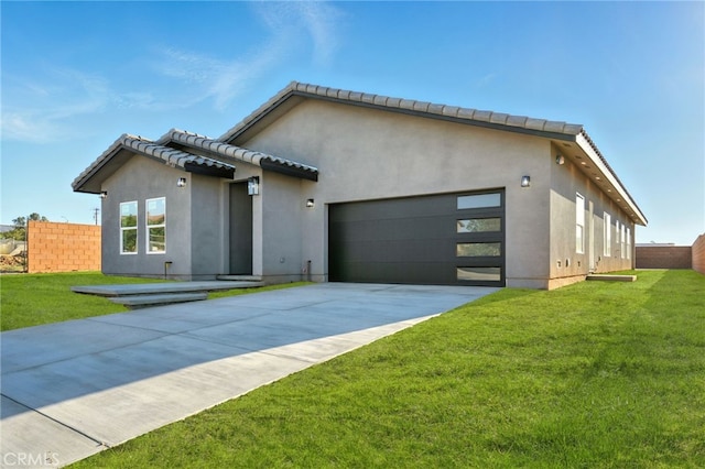 36733 42nd St E, Palmdale, CA 93552 - view of front facade with stucco siding, driveway, a garage, and a tile roof