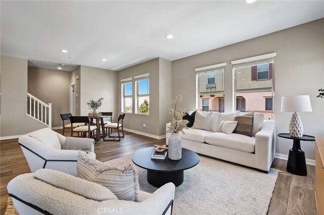 109 Alder Rdg, Lake Forest, CA 92610 - living area featuring stairway, wood finished floors, and recessed lighting