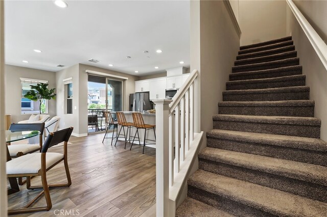109 Alder Rdg, Lake Forest, CA 92610 - stairs with wood finished floors and recessed lighting