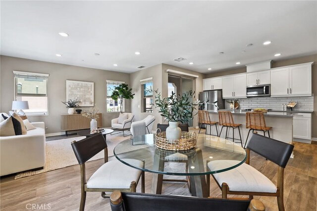109 Alder Rdg, Lake Forest, CA 92610 - dining space featuring wood finished floors and recessed lighting