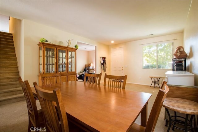 2207 Rockrose St, Palmdale, CA 93551 - dining area featuring carpet floors and stairs