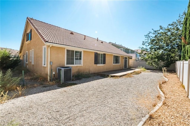 2207 Rockrose St, Palmdale, CA 93551 - back of property with a fenced backyard, stucco siding, a tile roof, and a patio area