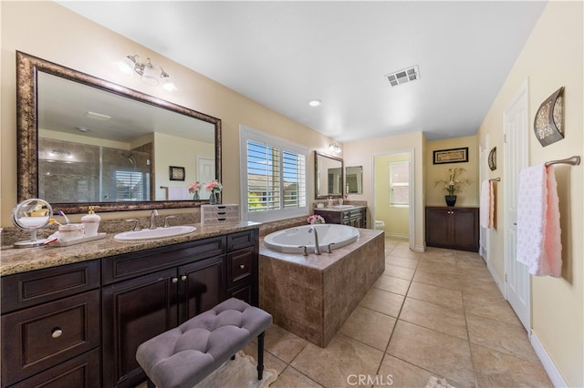 6585 Youngstown St, Chino, CA 91710 - full bath featuring vanity, a shower stall, a bath, and tile patterned flooring