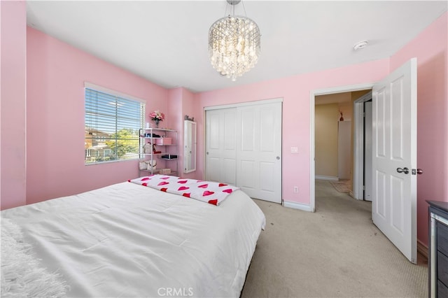 6585 Youngstown St, Chino, CA 91710 - bedroom with a chandelier, light carpet, and a closet