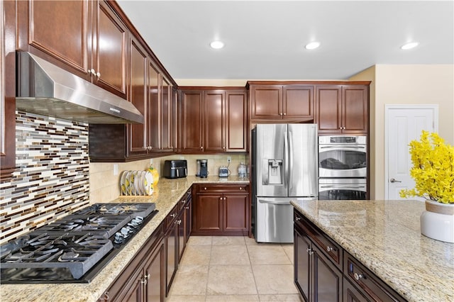 6585 Youngstown St, Chino, CA 91710 - kitchen featuring stainless steel appliances, under cabinet range hood, backsplash, light stone counters, and recessed lighting
