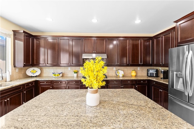 6585 Youngstown St, Chino, CA 91710 - kitchen with stainless steel fridge with ice dispenser, light stone countertops, decorative backsplash, and recessed lighting