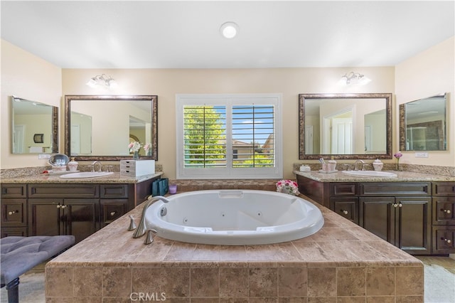 6585 Youngstown St, Chino, CA 91710 - full bathroom featuring a tub with jets and two vanities