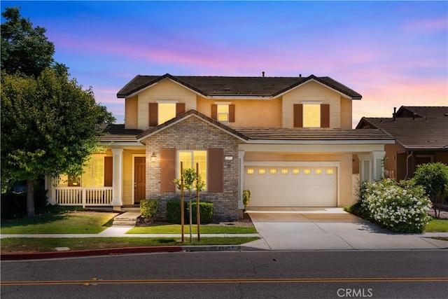 6585 Youngstown St, Chino, CA 91710 - traditional-style house with driveway, a garage, covered porch, a tile roof, and brick siding
