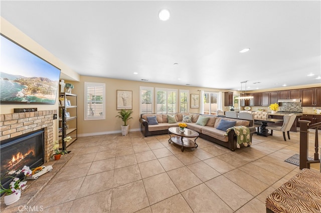 6585 Youngstown St, Chino, CA 91710 - living area featuring light tile patterned floors, recessed lighting, and a fireplace