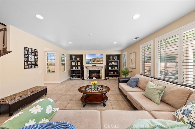 6585 Youngstown St, Chino, CA 91710 - tiled living area featuring built in features, recessed lighting, and a brick fireplace