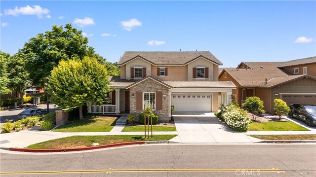 6585 Youngstown St, Chino, CA 91710 - traditional-style home featuring a tiled roof, driveway, a garage, and a front lawn